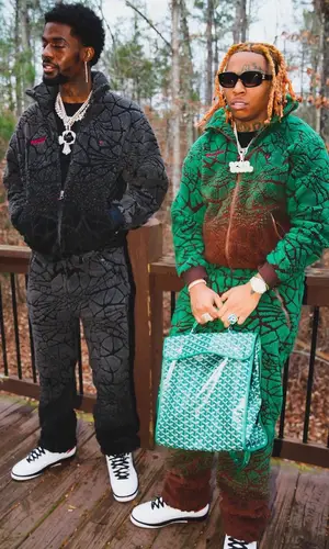 Lil Gotit wearing Goyard backpack