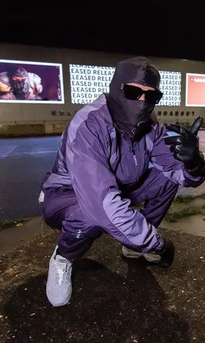 Meekz wearing Nike sneakers