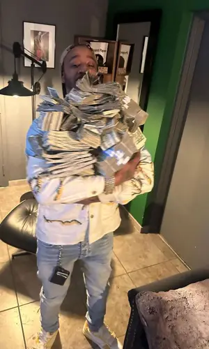 Benny The Butcher wearing Amiri jeans
