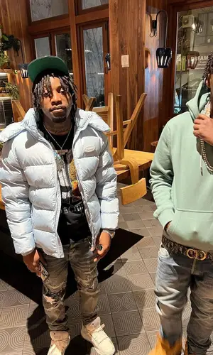 Lil Tjay wearing Timberland boots
