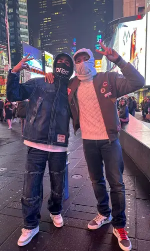 Achraf Hakimi’s Outfit in True Religion Jacket, Louis Vuitton Sneakers & Supreme Hat (2023)