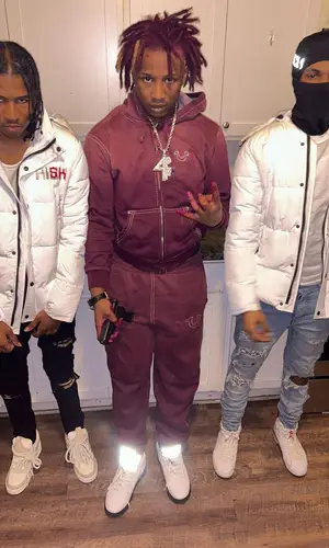 Lil Kee wearing Supreme hoody