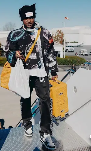 Terry Rozier wearing Louis Vuitton pants