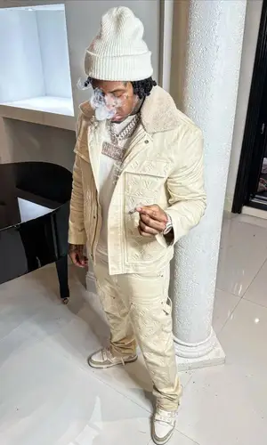 Moneybagg Yo wearing Louis Vuitton jacket