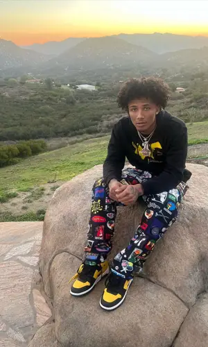 Mikey wearing Supreme pants