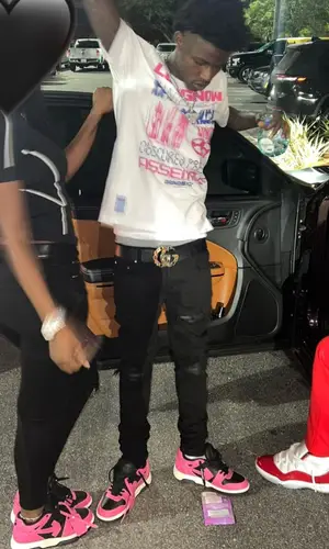 Quando Rondo wearing Gucci belt