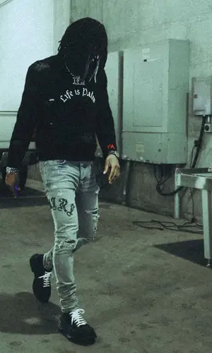 Ja Morant’s Outfit in Palm Angels Sweater, Amiri Jeans & Alexander McQueen Sneakers (2023)
