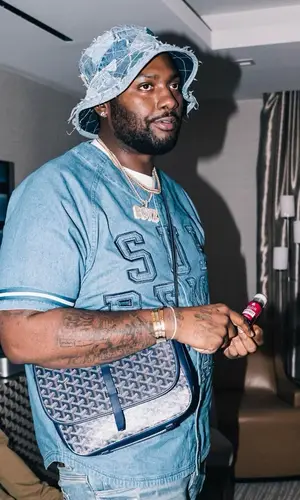 Peezy wearing Gallery Dept. hat