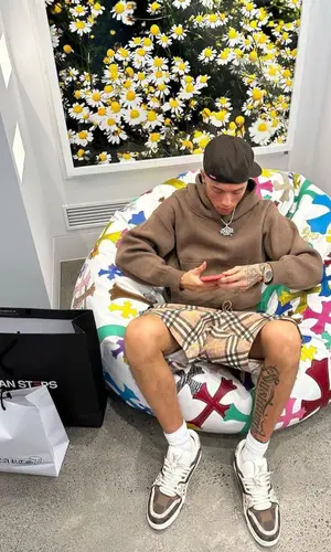 Central Cee wearing Burberry shorts
