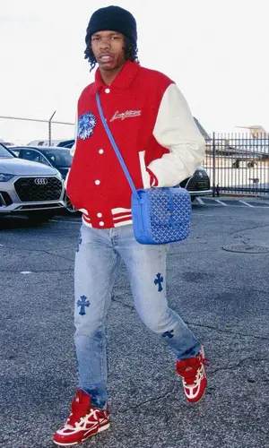 Lil Baby’s Outfit in Louis Vuitton Jacket, Chrome Hearts Jeans & Goyard Bag (2023)
