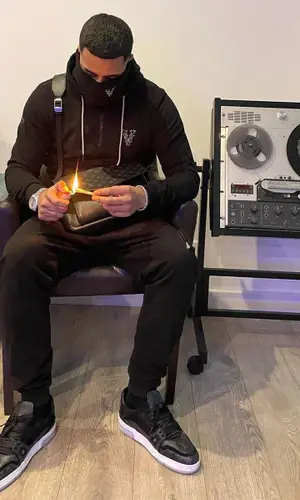 Ashe 22 wearing Louis Vuitton bag