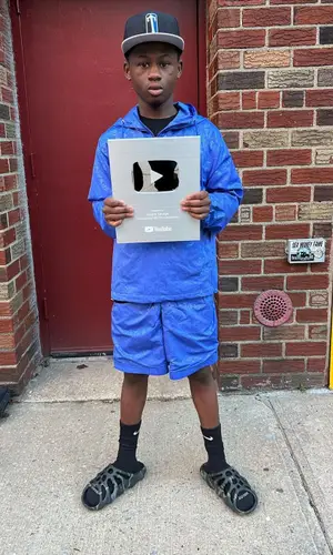 Bouba Savage’s Outfit in Trapstar Shorts, Imran Potato Sandals & Nike Socks (2022)