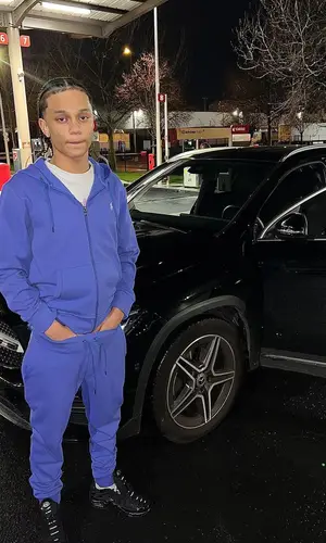 Fave wearing Nike sneakers