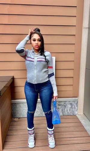 Jania Meshell wearing Dior boots