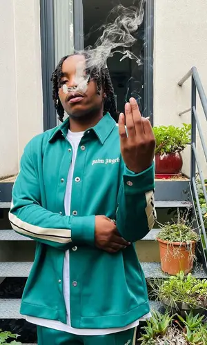 Junior Bvndo wearing Palm Angels shirt