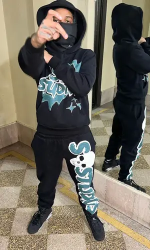 C Blu wearing Stainbandzstudios pants
