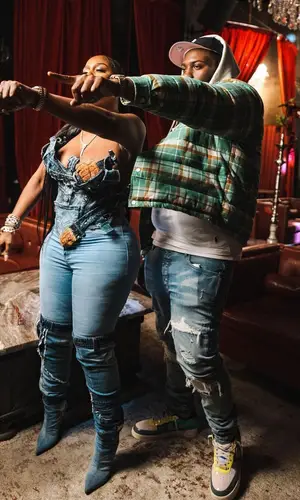 Peezy wearing New Era cap