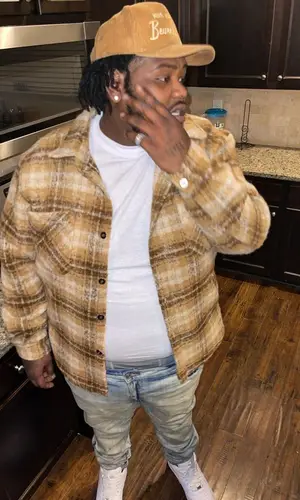 Biggaveli wearing Homme + Femme cap