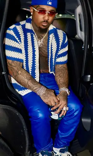 Doe Boy wearing Purple Brand pants