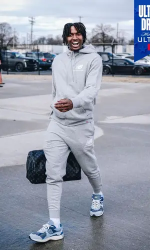 Tyrese Maxey’s Outfit in New Balance Hoodie & Louis Vuitton Bag (2023)