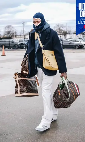 PJ Tucker wearing Louis Vuitton bag