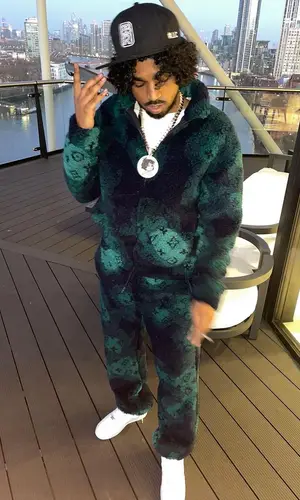 Mowgs wearing Nike sneakers