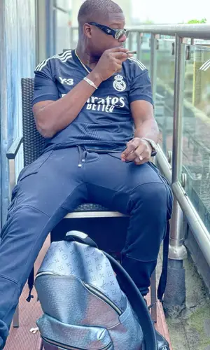 Ninho wearing Prada eyewear