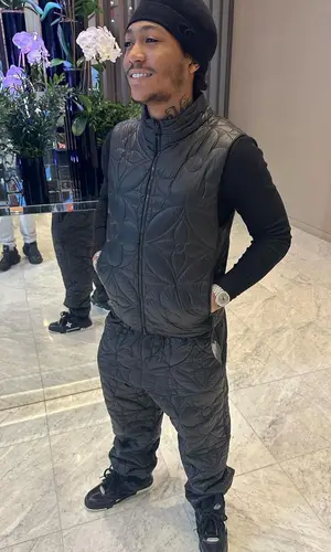 Lil Meech wearing Louis Vuitton jacket