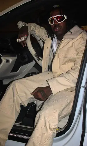 EST Gee wearing Louis Vuitton jeans