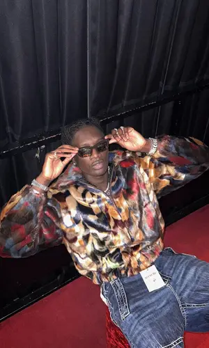 Jnr Choi wearing Supreme jacket
