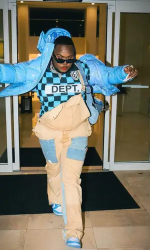 Saucy Santana’s Outfit in Moncler Jacket, Gallery Dept. Jersey & Prada Eyewear (2023)