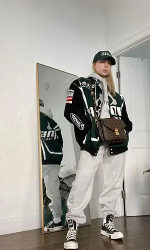 Lil Debbie wearing Pleasures cap