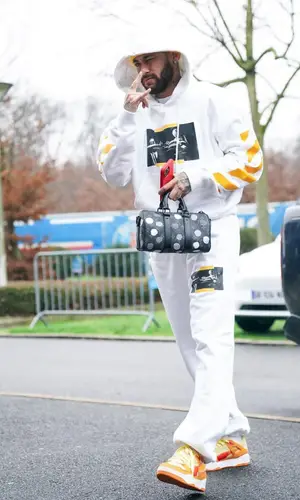 Neymar’s Outfit in Off-White Hoodie, Puma Sneakers & Louis Vuitton Bag (2023)