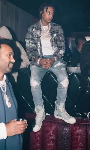 Skilla Baby wearing Amiri shirt