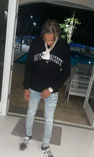 Skilla Baby wearing Givenchy sweatshirt