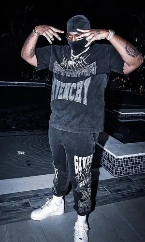 Peezy wearing Givenchy pants