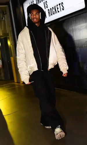 Joshua Christopher’s Outfit in Alpha Industries Jacket, Vetements Boots & Apple (2023)