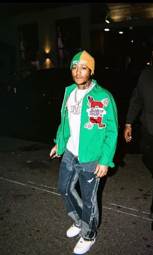 Lil Meech wearing Denim Tears jacket