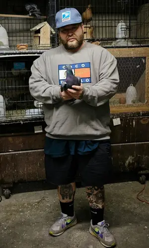 Action Bronson wearing Baklava Flea Market sweater