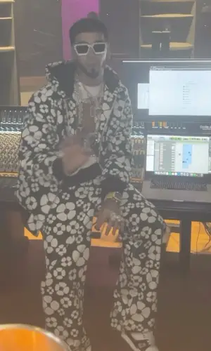Anuel AA wearing Carhartt t-shirt