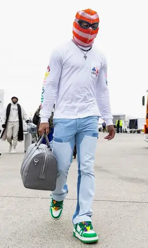 Xavier McKinney wearing Gucci bag