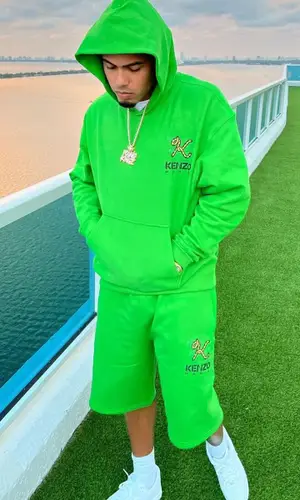 Myke Towers wearing Kenzo hoody