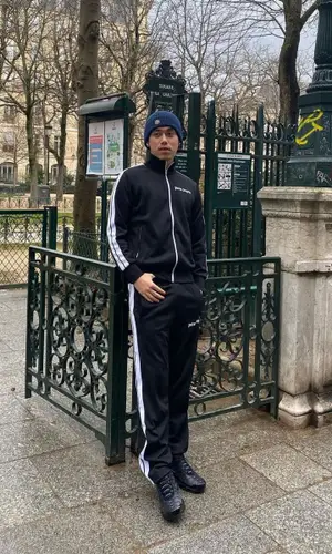 J2Lasteu wearing Nike sneakers