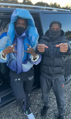 Russ Millions wearing Gallery Dept. pants