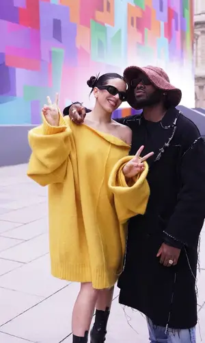 Rosalia’s Outfit in Raf Simons Sweater, Versace Boots & Miu Miu Eyewear (2023)