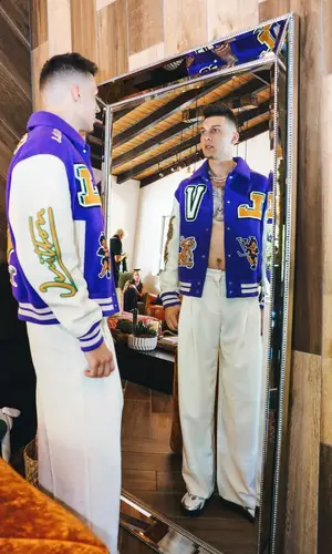 Tyler Herro wearing Louis Vuitton jacket