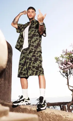 Emis Killa wearing MSGM sneakers