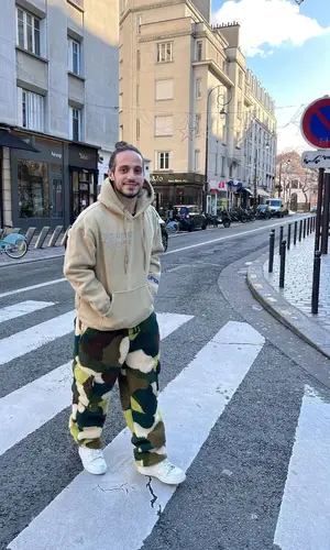 Russ wearing KidSuper hoody