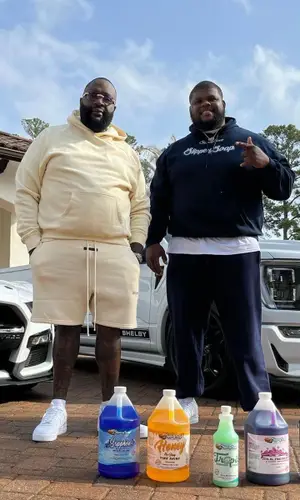 Rick Ross wearing Fear of God hoody