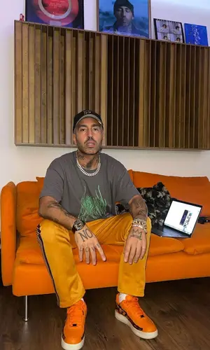 Luche wearing New Era cap